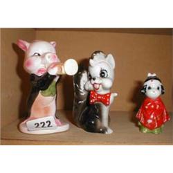 Three figures: a pig, Betty Boo, and one other