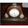 A c1920 serpentine mantel clock