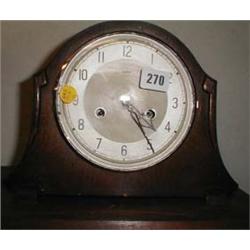 A c1930's oak cased Enfield mantel clock with key