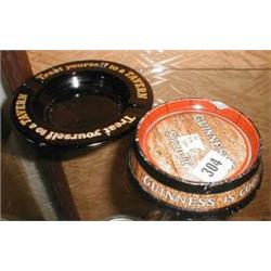 An advertising "Guinness Stout" ashtray by Minton's together with one other