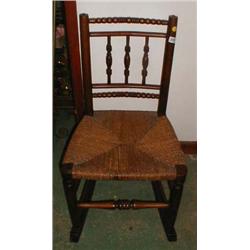 A C19th wicker seated rocking chair with bobbin turned spindles to back
