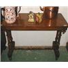 Image 1 : A Victorian walnut side-table with turned supports