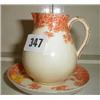 Image 1 : A C19th Royal Worcester cream jug on stand in cream and orange