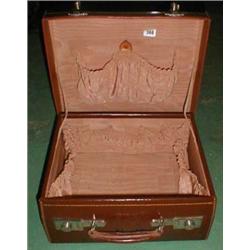 A c1920's leather vanity case with lined and fitted interior