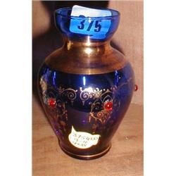 A c1900 gilt and jeweled blue glass bud vase