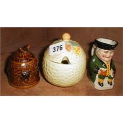 A honey jar together with a c1920's preserve jar and a c1900 terracotta Toby jug