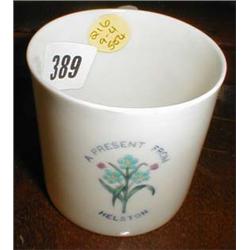 A C19th "Present from Helston" mug by Goss with enamel forget me not decoration