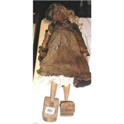 A C19th wooden jointed "clog" doll with "Horse Hair" hair in original clothes