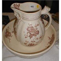 A late C19th wash jug and bowl with brown floral decoration and relief work, understamped "Avon"