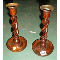 A c1930's pair of open barley twist candle sticks