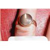 A rose gold dress ring