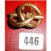 A pinch beck brooch with large yellow stone with etched decoration