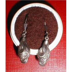 A pair of silver earrings