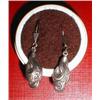 A pair of silver earrings