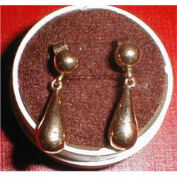 A pair of gold earrings