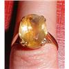 Image 1 : A gold ring with yellow stone