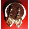 A pair of gold drop earrings
