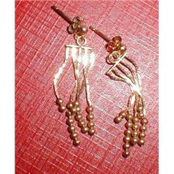A pair of gold drop earrings