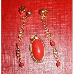 A coral and gold earrings and matching pendant