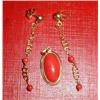 A coral and gold earrings and matching pendant