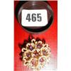 An 18ct gold brooch with Amethyst stones