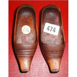 A pair of carved wooden shoes