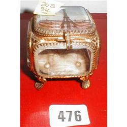 A C19th gilded trinket box with Eiffel Tower scene to lid