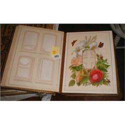 A leather bound Victorian photograph album with floral decoration