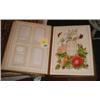 A leather bound Victorian photograph album with floral decoration