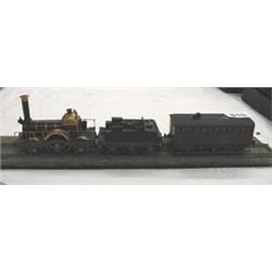 A finely engineered model brass steam train complete with track, rolling stock etc