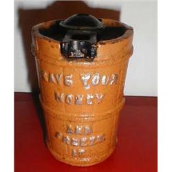 A reproduction cast iron money box "save your money and freeze it"