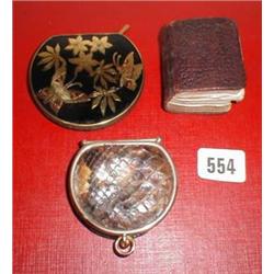 A C19th miniature leather bound prayer book together with a snake-skin purse and compact