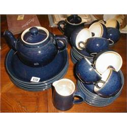 A quantity of dark blue Denby  table ware - 6 dinner plates, 8 side plates, 17 saucers, 9 cups, a te