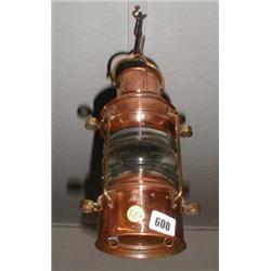 A C19th copper and brass ships anchor lamp complete with burner
