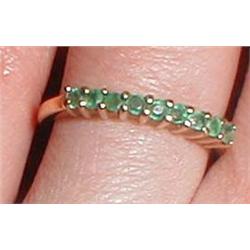 A 9ct gold ring set with emeralds