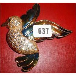 A large bird brooch with diamante decoration