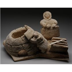 Sculpture of an Inuk Building an Igloo by Pauloosie Karpik - Pangnirtung 24" L. 14" H.  Good Conditi