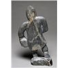 Image 2 : Sculpture of an Inuk Holding a Head by Josiah Kadlutiak Igloolik ca. 1970  12" H. 6 1/2" W.  Good Co