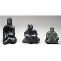 Three Toona Iquliq Carvings of Inuk Figures - Baker Lake, 7  H. 4  W., 4 1/4  H. 4  W. and 5 1/2  H.
