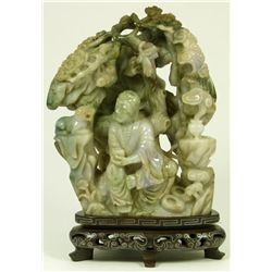 CHINESE CARVED MODEL OF AN ASCETIC IN A GROTTO