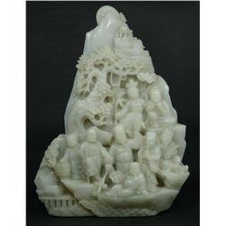 A CHINESE CARVED WHITE JADE BOULDER IMMORTAL GROUP