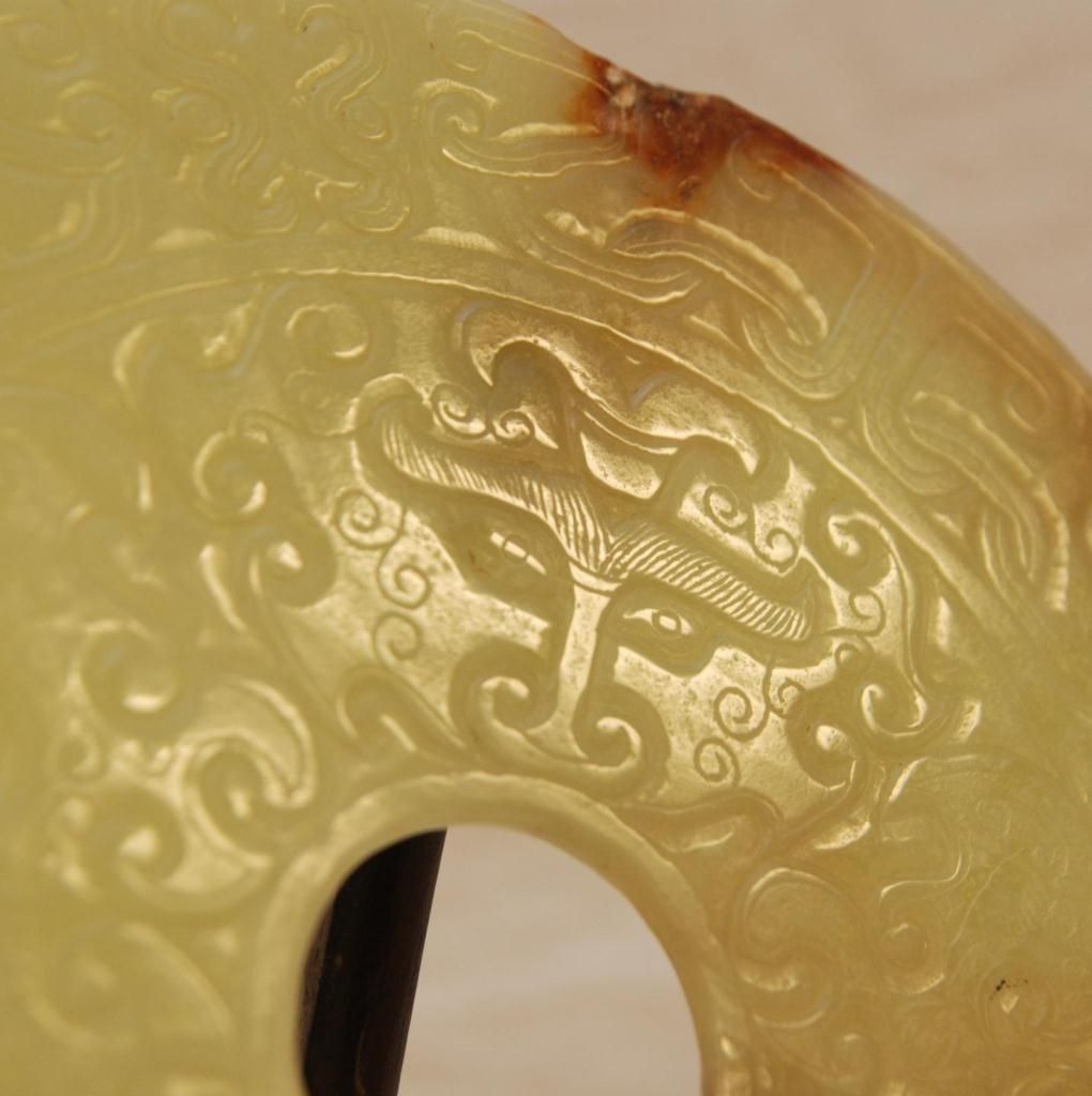 CHINESE ARCHAIC FORM JADE RELIEF BI DISC ON STAND