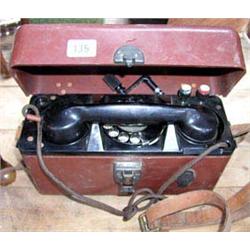 A collectable early portable wind-up telephone in brown plastic case, stamp No.416099, GPO 250A.