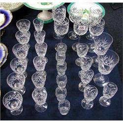 A quality suite of Crystal glassware including six tall stem, six sherry, six licquor, six sundae? G