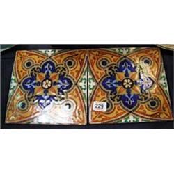 Two hand painted eastern tiles.