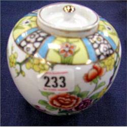 A Noritake jar with lid, c1910, hand painted.