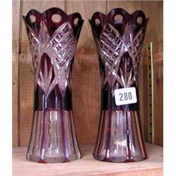 A pair of red overlay glass vases.