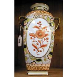 A large Nippon two handled floral decorated vase.