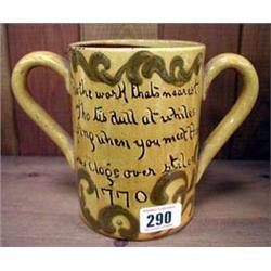 An Exeter pottery, two handled loving mug.