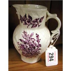 A Royal Worcester jug in white with decorated flowers and Bacchus spout.